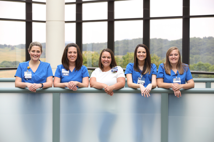 Carilion nurses on a skywalk overlooking the Blue Ridge Mountains