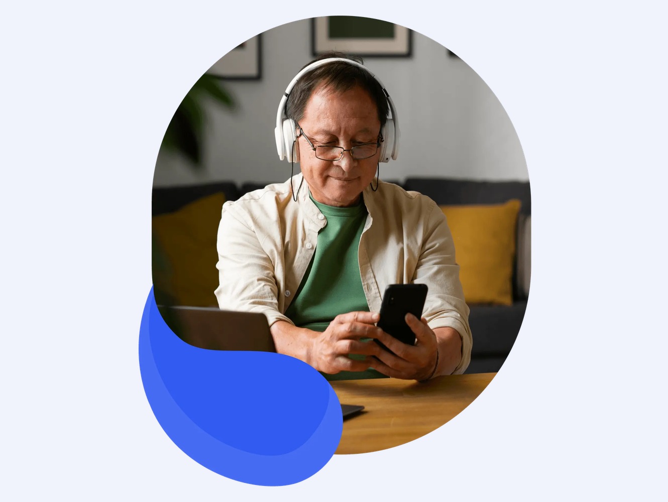 An older man completing a phone screening at his kitchen table