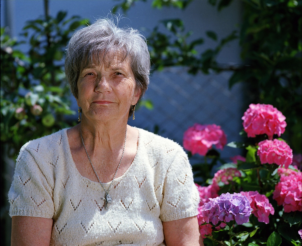 An older woman in a garden