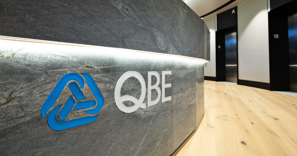 The QBE brandmark in an office lobby